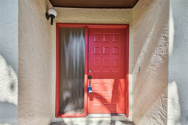 2953 Yucca Ct, Palm Harbor, FL 34684 - doorway to property featuring stucco siding