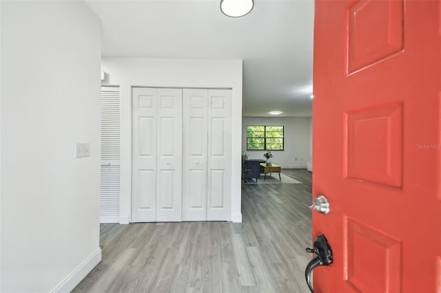 2953 Yucca Ct, Palm Harbor, FL 34684 - entryway with light wood-style floors and baseboards