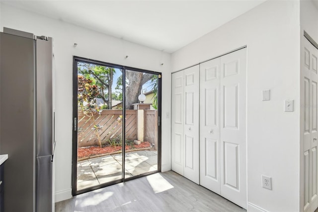 2953 Yucca Ct, Palm Harbor, FL 34684 - entryway featuring light wood-type flooring and baseboards