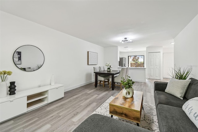 2953 Yucca Ct, Palm Harbor, FL 34684 - living area with light wood-style flooring and baseboards