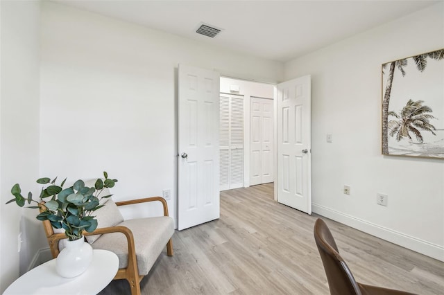 2953 Yucca Ct, Palm Harbor, FL 34684 - living area featuring light wood-style floors and baseboards