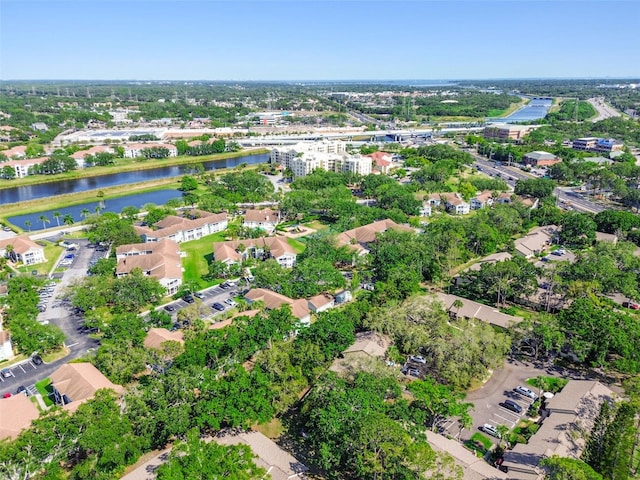 2953 Yucca Ct, Palm Harbor, FL 34684 - aerial view of property's location with a large body of water and a tree filled landscape