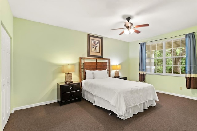 3506 54th Dr W Unit 108, Bradenton, FL 34210 - bedroom with baseboards, ceiling fan, a closet, and dark colored carpet
