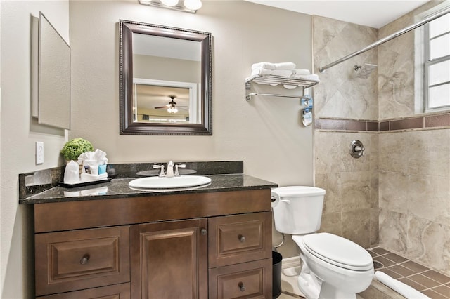 3506 54th Dr W Unit 108, Bradenton, FL 34210 - full bathroom with vanity, a ceiling fan, a tile shower, and toilet