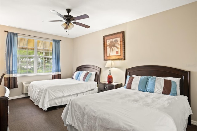 3506 54th Dr W Unit 108, Bradenton, FL 34210 - carpeted bedroom featuring baseboards, a ceiling fan, and an AC wall unit
