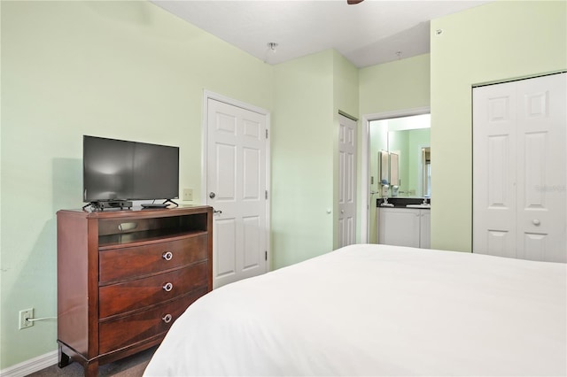 3506 54th Dr W Unit 108, Bradenton, FL 34210 - bedroom with connected bathroom and baseboards