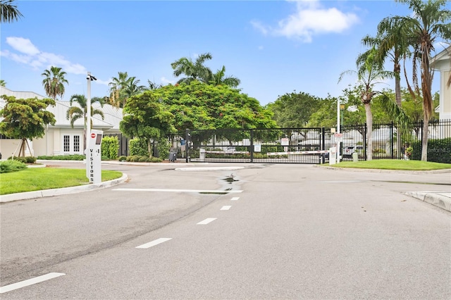 3506 54th Dr W Unit 108, Bradenton, FL 34210 - view of road featuring a gated entry, a gate, and curbs