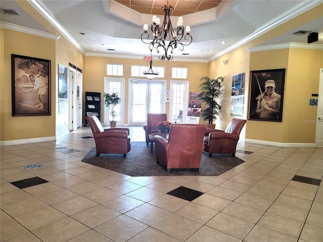 3506 54th Dr W Unit 108, Bradenton, FL 34210 - living room with baseboards, a tray ceiling, a notable chandelier, and light tile patterned floors