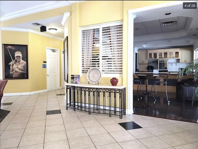 3506 54th Dr W Unit 108, Bradenton, FL 34210 - hall with tile patterned flooring, ornamental molding, baseboards, and visible vents
