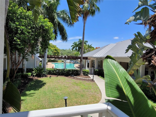 3506 54th Dr W Unit 108, Bradenton, FL 34210 - view of yard featuring a community pool and fence