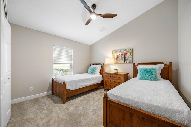 bedroom with baseboards, a ceiling fan, light colored carpet, and vaulted ceiling