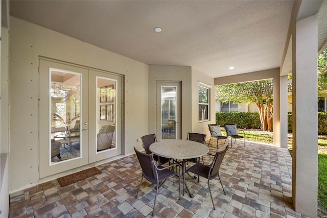 view of patio featuring outdoor dining area and french doors