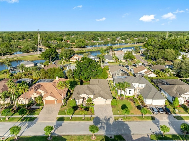 bird's eye view featuring a water view and a residential view