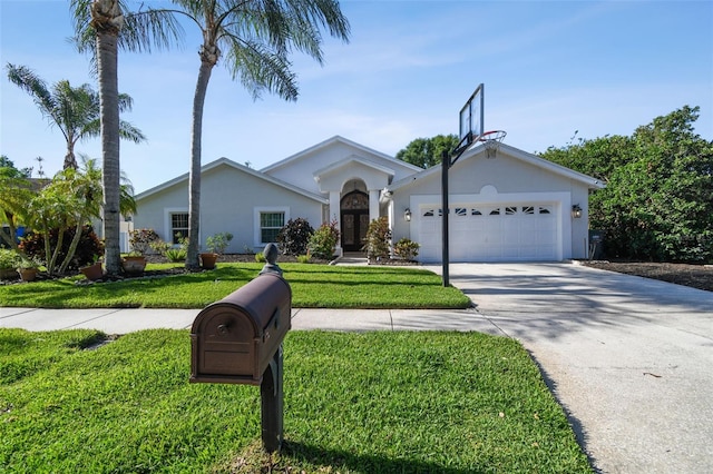 3238 Cullendale Dr, Tampa, FL 33618 - ranch-style home with an attached garage, stucco siding, a front yard, and concrete driveway