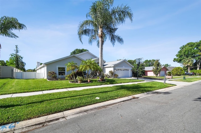 3238 Cullendale Dr, Tampa, FL 33618 - ranch-style home featuring a front yard, a garage, fence, concrete driveway, and stucco siding