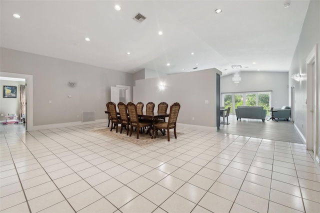 3238 Cullendale Dr, Tampa, FL 33618 - dining space with light tile patterned floors, vaulted ceiling, a chandelier, and visible vents