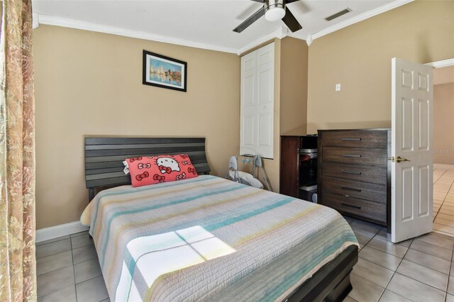 3238 Cullendale Dr, Tampa, FL 33618 - bedroom featuring light tile patterned floors, baseboards, ornamental molding, and visible vents