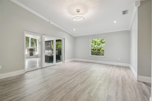 3238 Cullendale Dr, Tampa, FL 33618 - spare room with visible vents, ornamental molding, a wealth of natural light, and light wood finished floors
