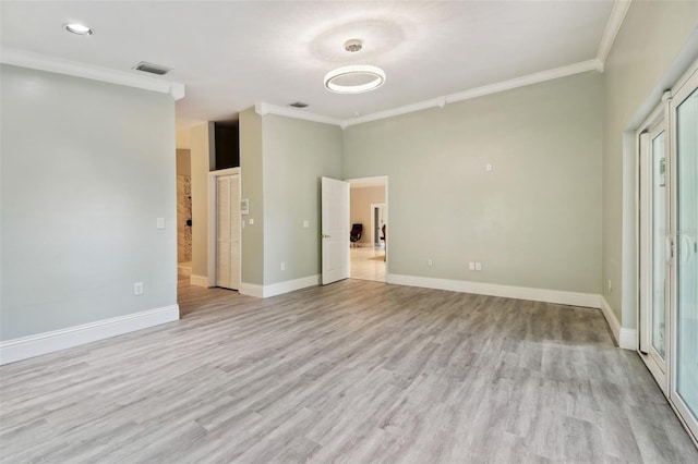3238 Cullendale Dr, Tampa, FL 33618 - unfurnished bedroom featuring crown molding, baseboards, light wood-type flooring, and visible vents