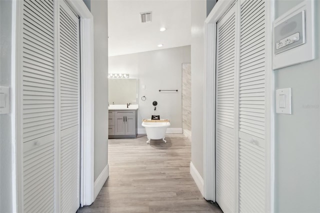 3238 Cullendale Dr, Tampa, FL 33618 - full bath featuring vanity, baseboards, wood finished floors, visible vents, and a closet