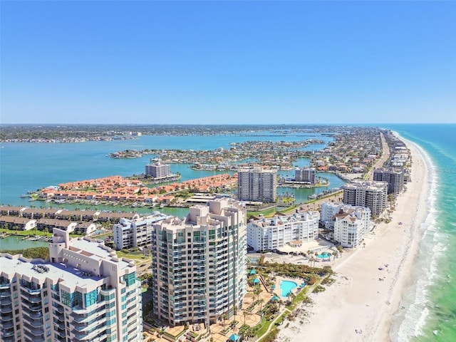 aerial view with a city view, a beach view, and a water view