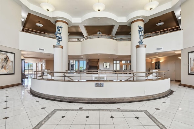 welcome area with decorative columns and visible vents