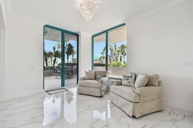 sitting room with a chandelier, expansive windows, baseboards, marble finish floor, and ornamental molding