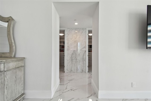 bathroom with baseboards, recessed lighting, a spacious closet, and marble finish floor