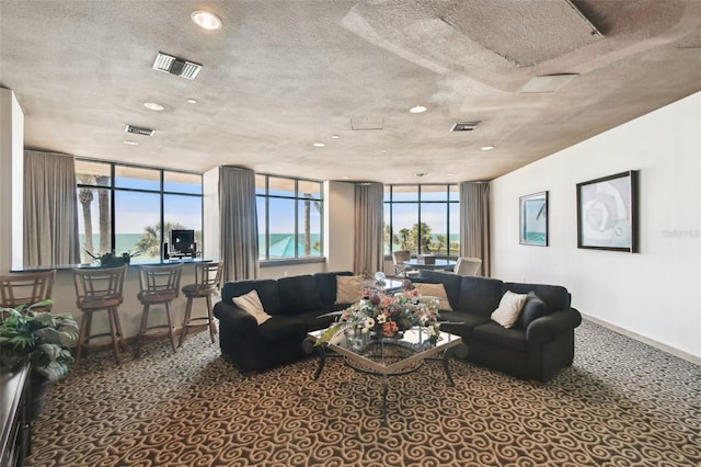 carpeted living room featuring recessed lighting and visible vents