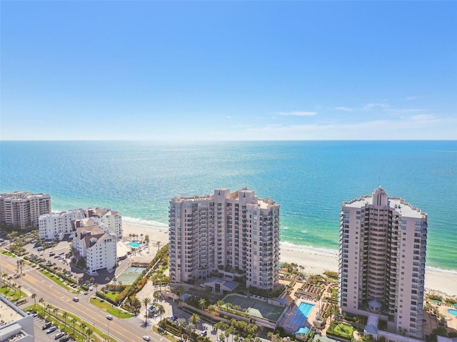 drone / aerial view featuring a view of the beach and a water view