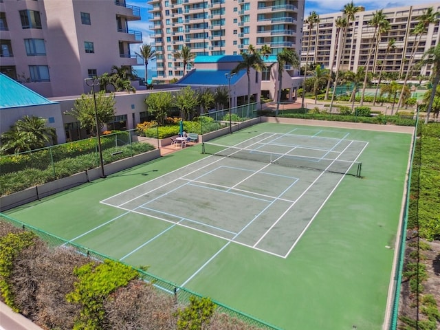 view of sport court featuring fence