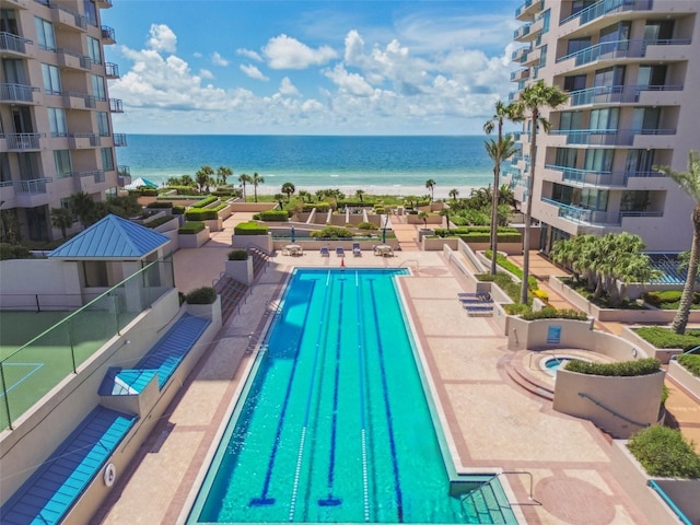 view of pool featuring a water view
