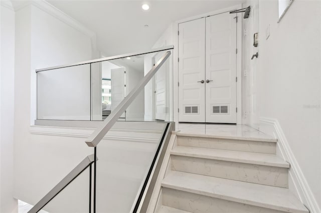 stairs with recessed lighting and marble finish floor