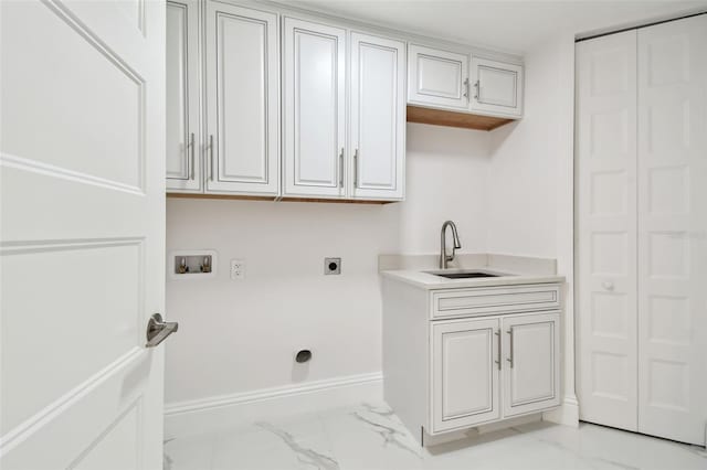 clothes washing area with cabinet space, washer hookup, a sink, marble finish floor, and hookup for an electric dryer