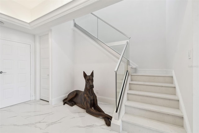 stairs featuring baseboards and marble finish floor
