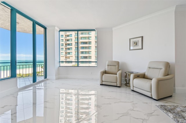 living area with baseboards, ornamental molding, marble finish floor, and a water view
