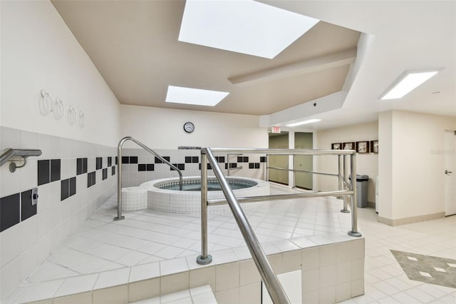 view of pool with a skylight
