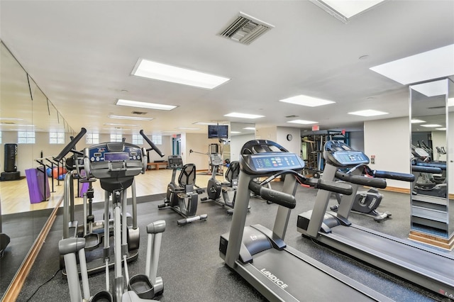 exercise room featuring visible vents