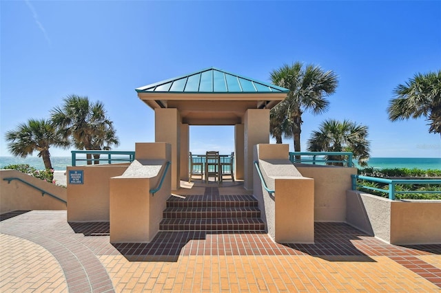 view of community featuring a gazebo and a water view