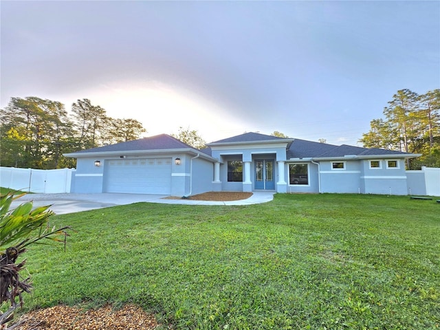 11240 Marvelwood, Brooksville, FL 34614 - view of front of property featuring stucco siding, an attached garage, and fence