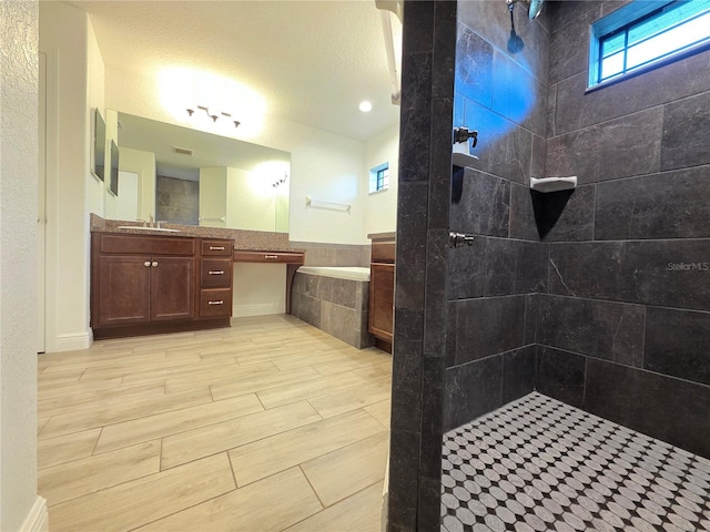 11240 Marvelwood, Brooksville, FL 34614 - full bath with vanity, visible vents, wood finished floors, and tiled shower