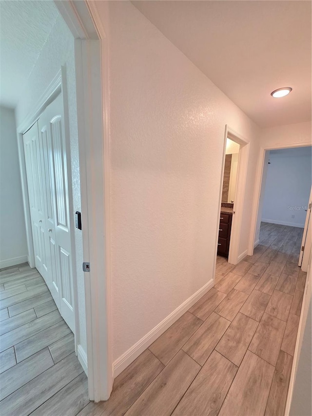 11240 Marvelwood, Brooksville, FL 34614 - hall with baseboards and wood finish floors