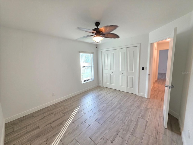 11240 Marvelwood, Brooksville, FL 34614 - unfurnished bedroom featuring a closet, baseboards, and light wood-style floors