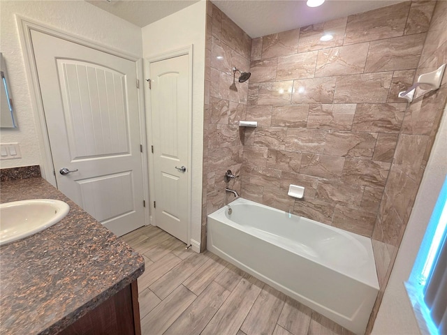 11240 Marvelwood, Brooksville, FL 34614 - bathroom featuring vanity, shower / bathtub combination, and wood finished floors