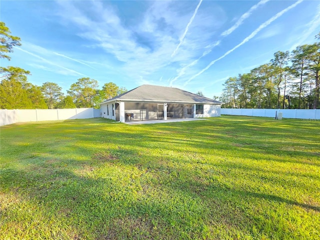 11240 Marvelwood, Brooksville, FL 34614 - rear view of house featuring a yard, a sunroom, and a fenced backyard