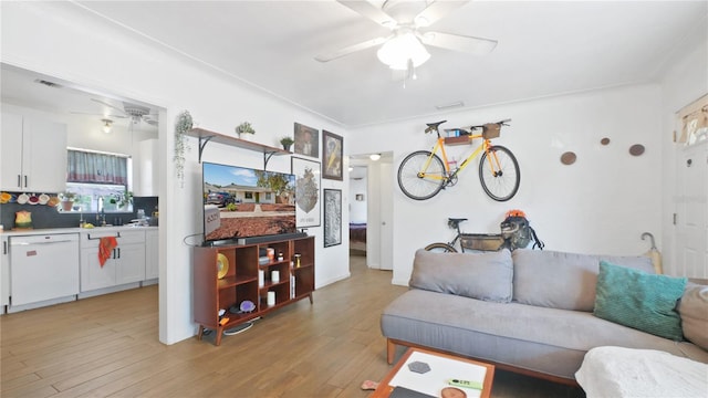 6325 9th Ave S, Gulfport, FL 33707 - living room featuring ceiling fan and light wood-style floors
