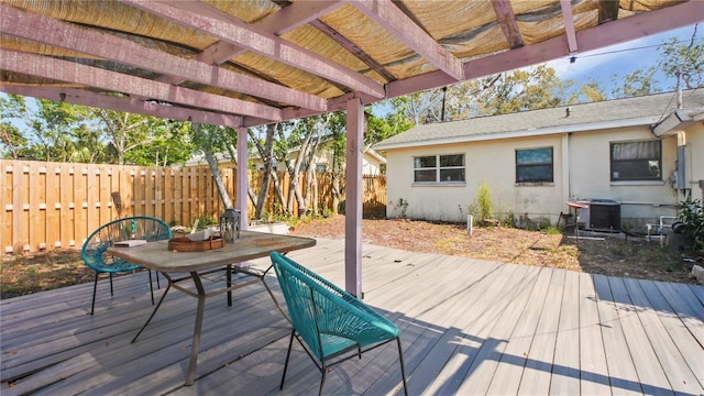 6325 9th Ave S, Gulfport, FL 33707 - wooden deck with a fenced backyard, central AC, and a pergola