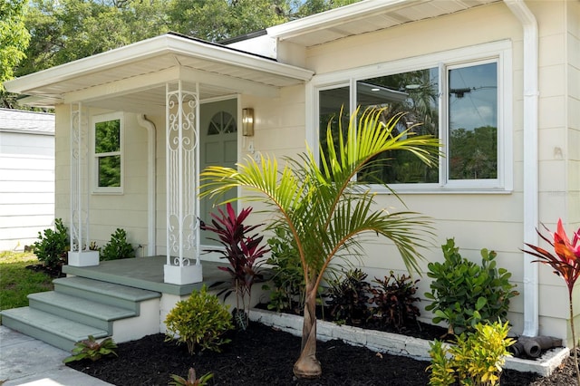 1443 Paloma Ln, Dunedin, FL 34698 - doorway to property featuring covered porch
