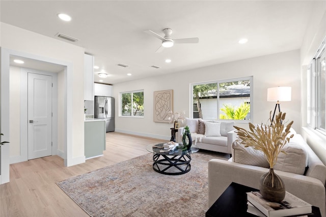 1443 Paloma Ln, Dunedin, FL 34698 - living area with light wood-type flooring, a ceiling fan, recessed lighting, and baseboards