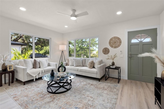 1443 Paloma Ln, Dunedin, FL 34698 - living room with light wood-style floors, ceiling fan, recessed lighting, and baseboards